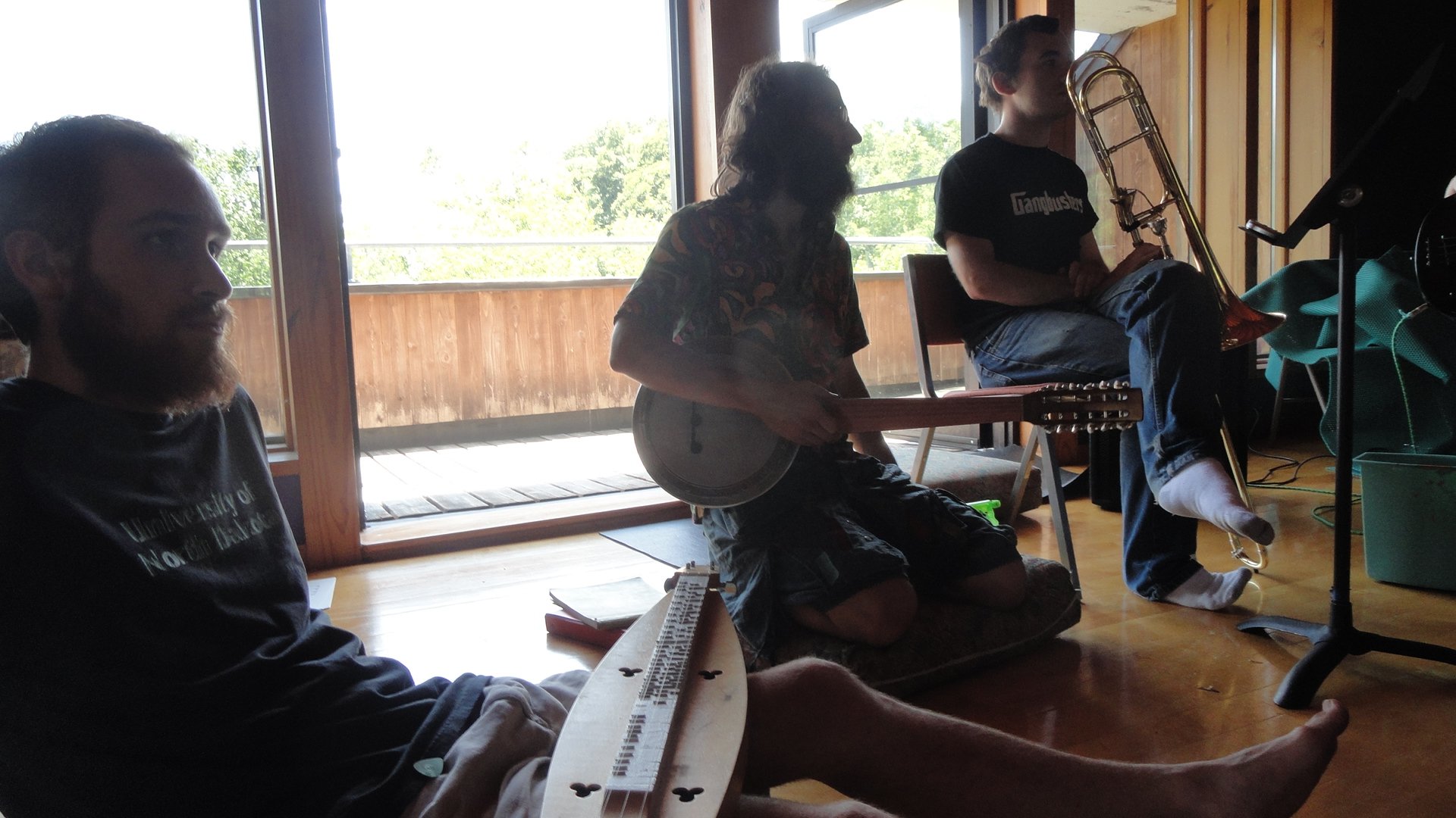 Studying microtones, instruments in lap